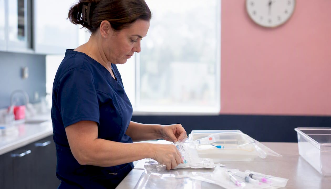 Nurse preparing egg retrieval instruments