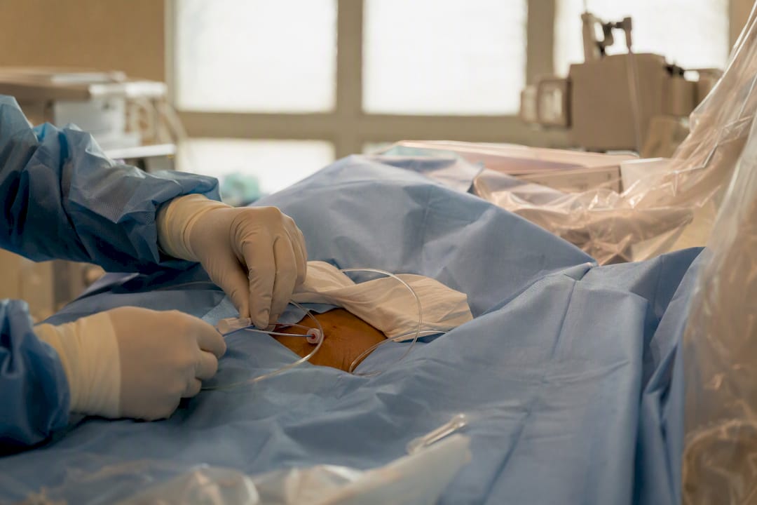 Close-up of hands performing fallopian tube recanalization