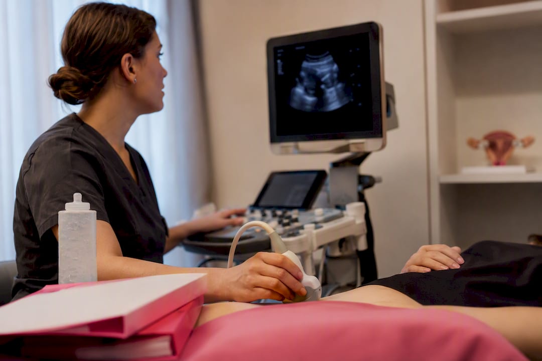 Nurse measuring ovarian reserve in fertility clinic
